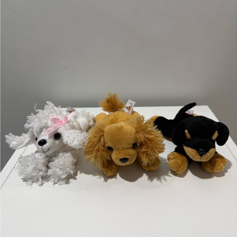 Three Unipak Stuffed Animal Dogs